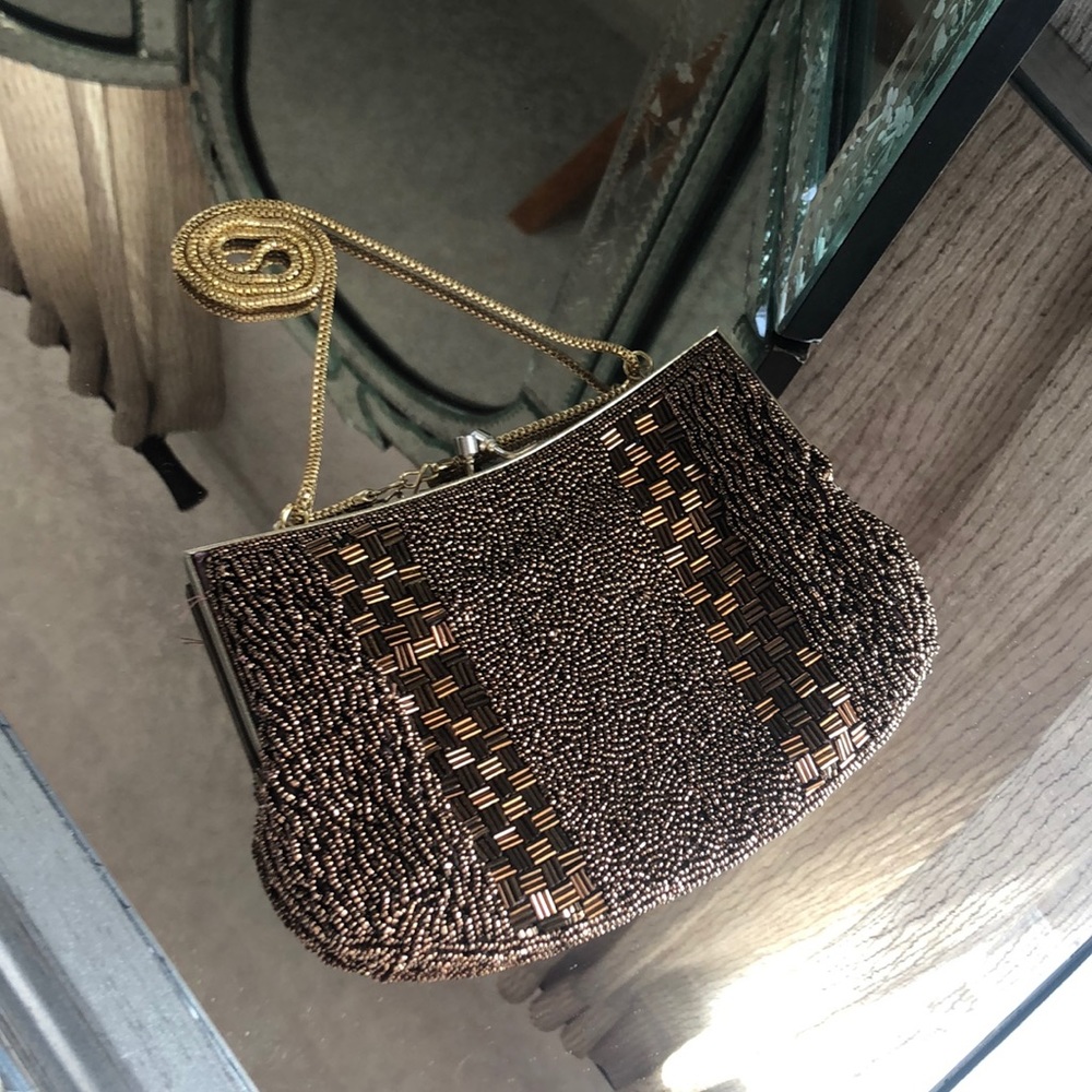 Copper colored beaded bag.